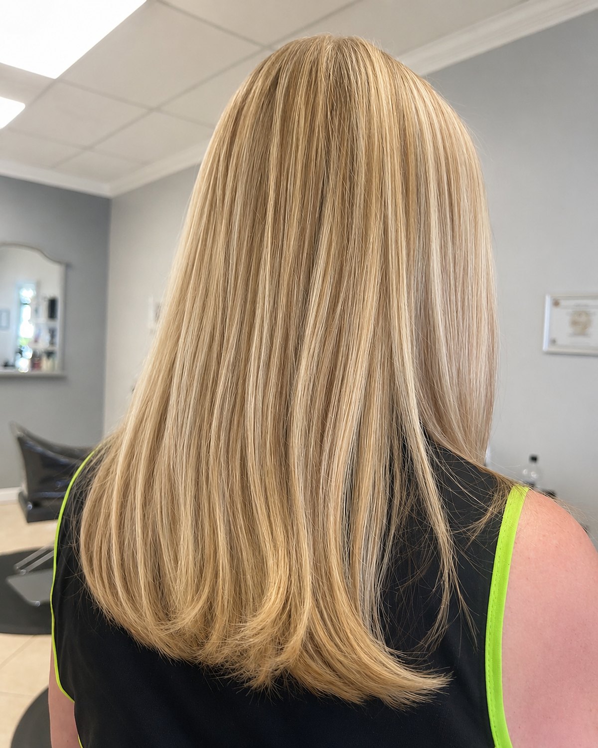 Buttercream blonde worn long — Toucheé Organic Salon, Juno Beach