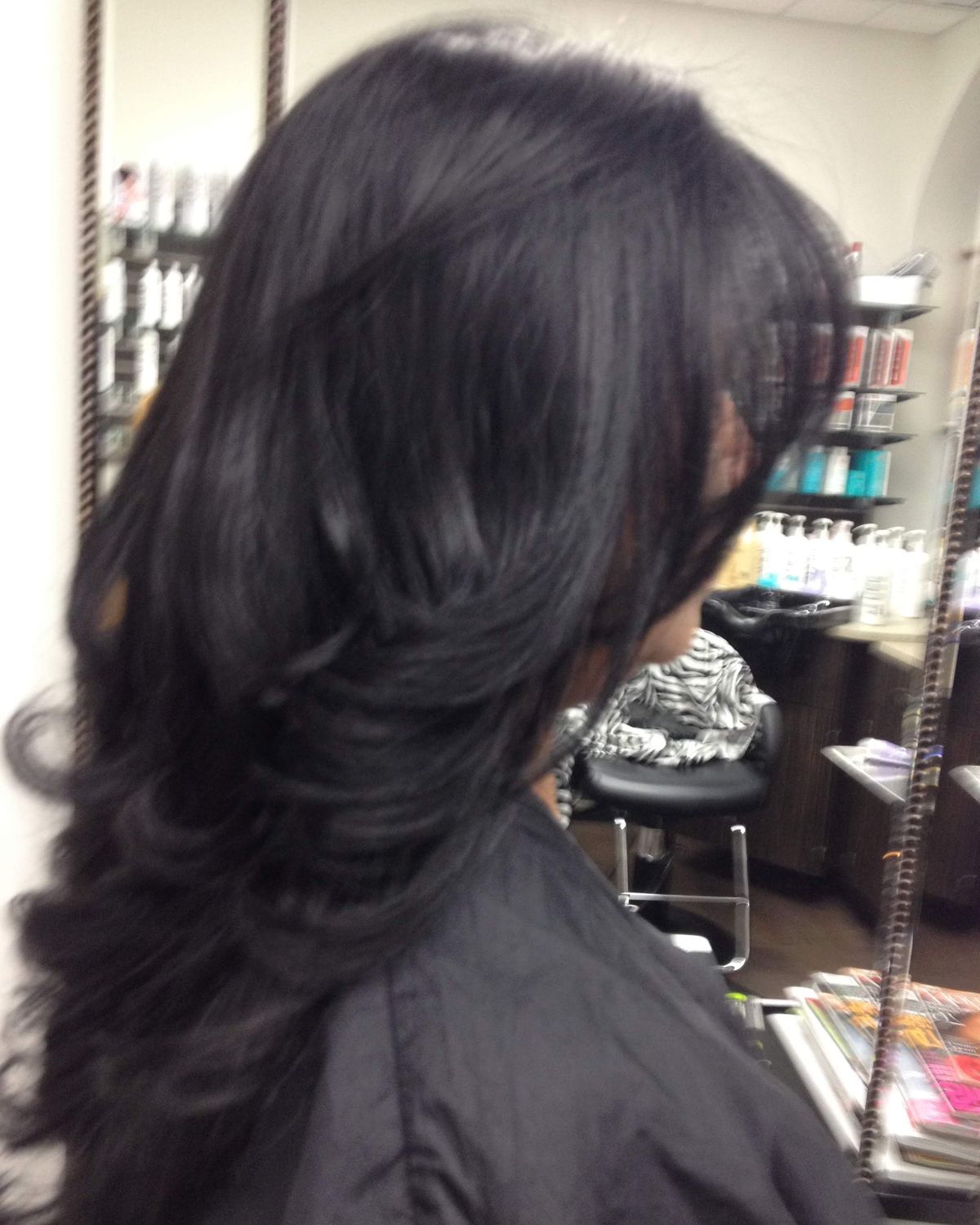 Near-black brunette with deep movement — Toucheé Organic Salon, Juno Beach